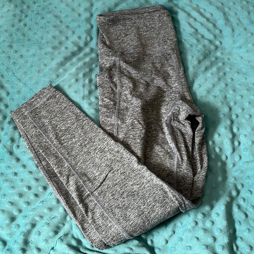 Grey high waisted leggings with pockets. Never worn.